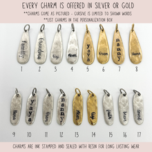 All charms can be order in silver or gold & have one word ink stamped on them & sealed with resin. 
Row 1 - Oblong Teardrop charms
#1-Silver family, #2-Silver Grandma, #3-Silver Gigi, #4-Silver Mom, #5-Gold yaya, #6-Gold Gram, #7-Gold nanny, #8-Gold Nana
Row 2 - Oblong Charms
#9-Silver Nana, #10-Silver yaya, #11-Silver Gram, #12-Silver nanny, #13-Gold Mom, #14-Gold Gigi, #15-Silver faith, #16-Silver brave, #17-Silver loved
