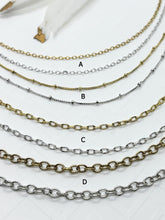 Four different chain styles for jewelry making.  The chains are arranged in rows, with the top row being a gold chain, followed by a silver chain with small beads, then a gold chain, and finally a silver chain.  The chains are labeled A, B, C, and D.