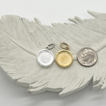 Showing finish options for the pendant in silver or gold and next to dime for size comparison.