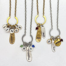 4 necklaces (2 in silver and 2 in gold). They have small cable textured chain with an open circle piece that the charms hang from. 
1st necklace has 6 small round initial charms and 1 long charm with the word family stamped on it that lays in the middle of the 6 initials. 
2nd-2 birthstone & 2 initials, an oblong teardrop charm with Grandma on it. 
3rd- birthstone, oblong teardrop with nana on it & 1 oblong oval with loved on it. 
4th- 1 initial, 1 gram, 1 round nona & 1 birthstone charm