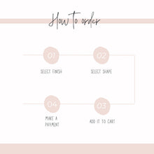 An infographic titled 'How to order' features a step-by-step flowchart in a neutral pink and white color scheme. Four numbered pink circles outline the ordering process with thin lines connecting them in a sequence: 01 Select Finish, 02 Select Shape, 03 Add It To Cart, and 04 Make a Payment. Designed to help customers easily navigate the customization options for handmade stud earrings.