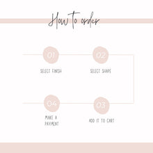 An infographic titled 'How to order' features a step-by-step flowchart in a neutral pink and white color scheme. Four numbered pink circles outline the ordering process with thin lines connecting them in a sequence: 01 Select Finish, 02 Select Shape, 03 Add It To Cart, and 04 Make a Payment. Designed to help customers easily navigate the customization options for handmade stud earrings.