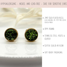 Product graphic for 8mm round olive green glitter stud earrings. A light pink top banner reads: "HYPOALLERGENIC - NICKEL AND LEAD-FREE - SAFE FOR SENSITIVE EARS." Left side displays gold-plated stud earrings filled with green glitter resin. Right side lists bullet points: 24K gold plated bezel (also in .999 fine silver), 8mm round, stainless steel posts & clutch, glitter sealed in resin, and gift ready packaging.
