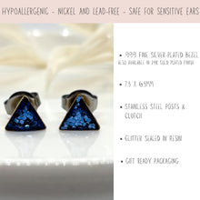 Product feature infographic for blue glitter resin triangle stud earrings showing hypoallergenic, nickel and lead-free details. Specifications outline .999 fine silver-plated bezel or 24K gold finish, 7.3 x 6.3mm size, stainless steel posts and clutch, resin-sealed glitter, and gift-ready packaging by Jenica Jewelry.