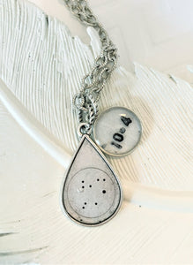 zodiac necklace with a birth date